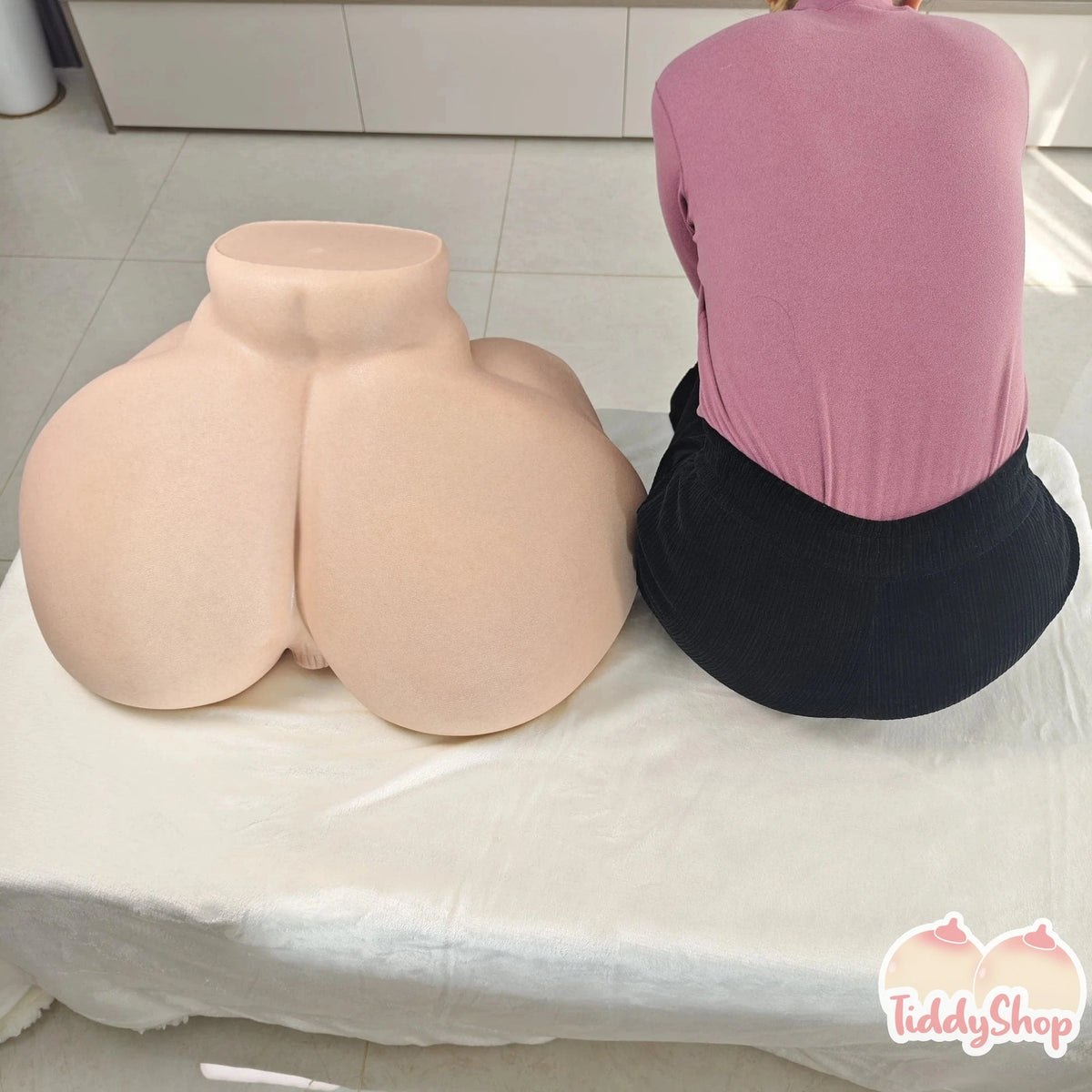 Seraphic and Heavenly Madame 94lb gel-filled booty toys side by side, 28 inches wide